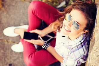 Woman Smiling with Phone